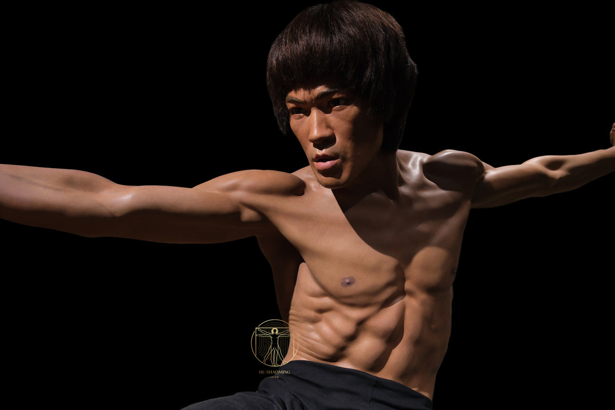 Detailed view of Bruce Lee silicone statue in a classic martial arts action pose