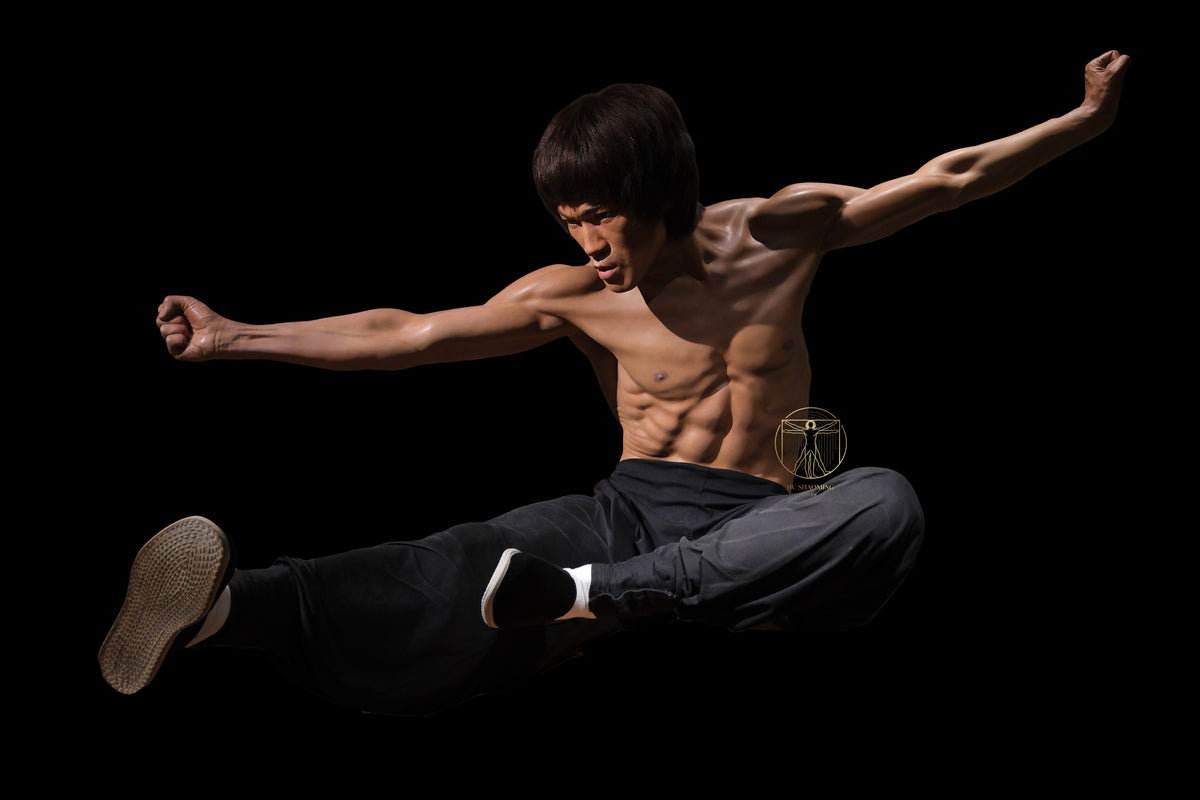 Full body life-size Bruce Lee custom wax-style statue in his iconic flying kick pose