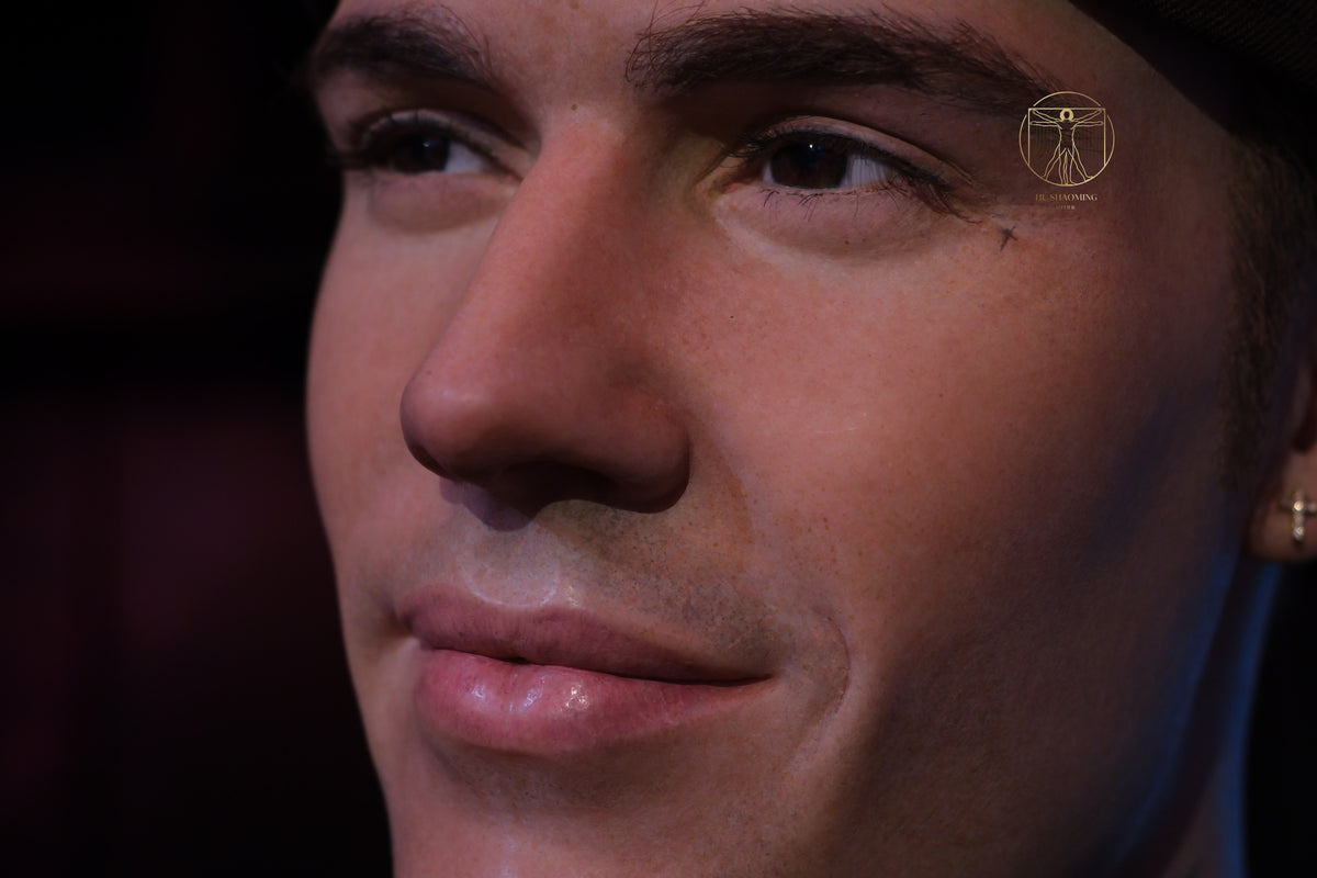 Macro view of realistic eyes and hand-punched lashes on Justin Bieber figure