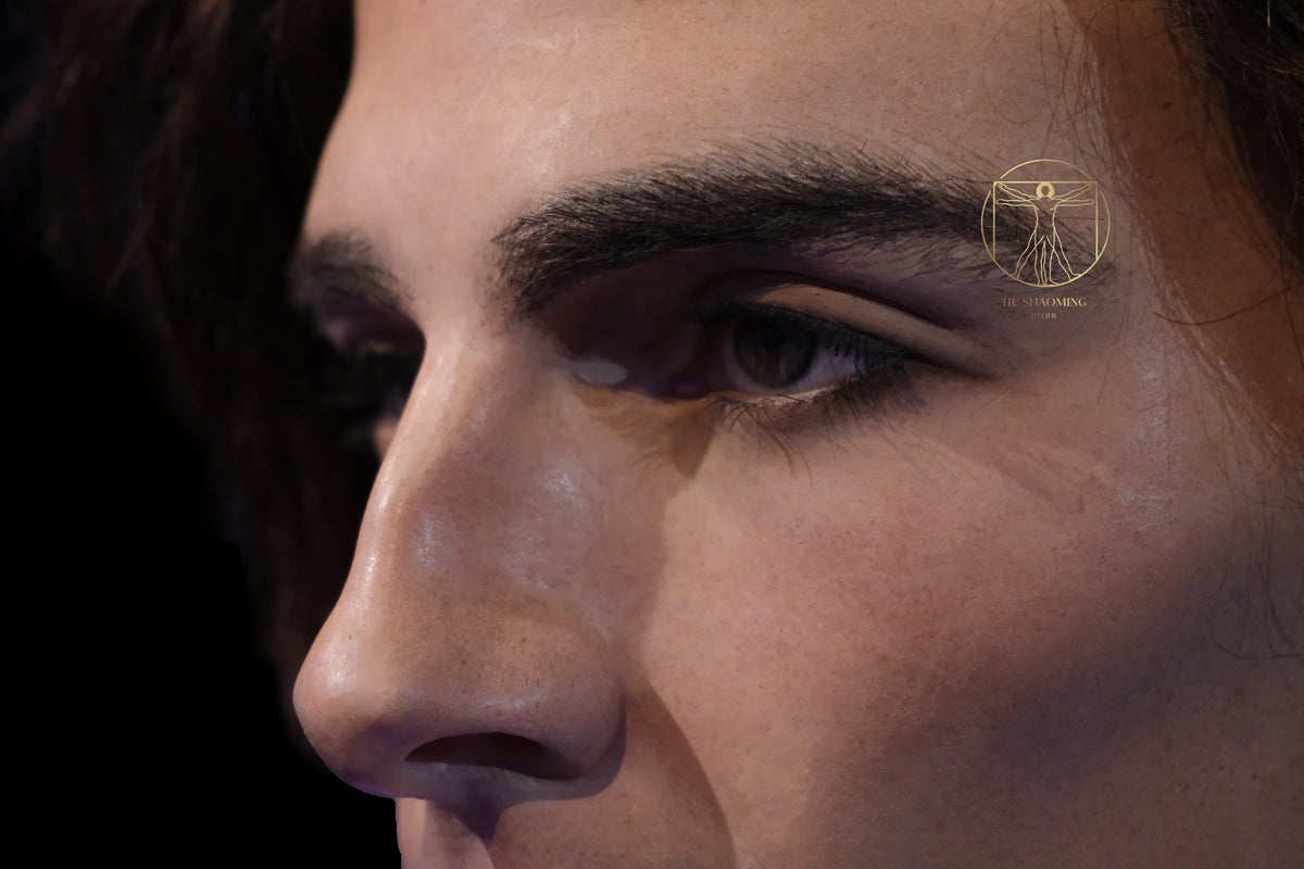 Extreme macro photo of realistic glass eye and hand-punched lashes on Timothée Chalamet figure