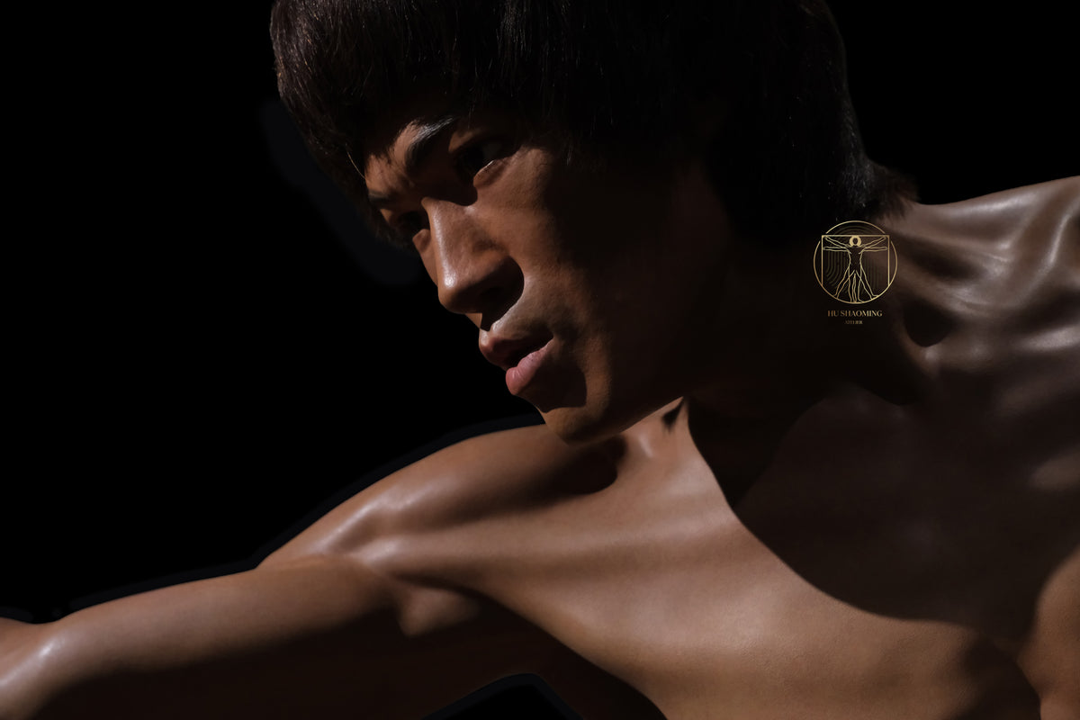 Custom lifelike silicone bust of Bruce Lee against a black background showing facial contour