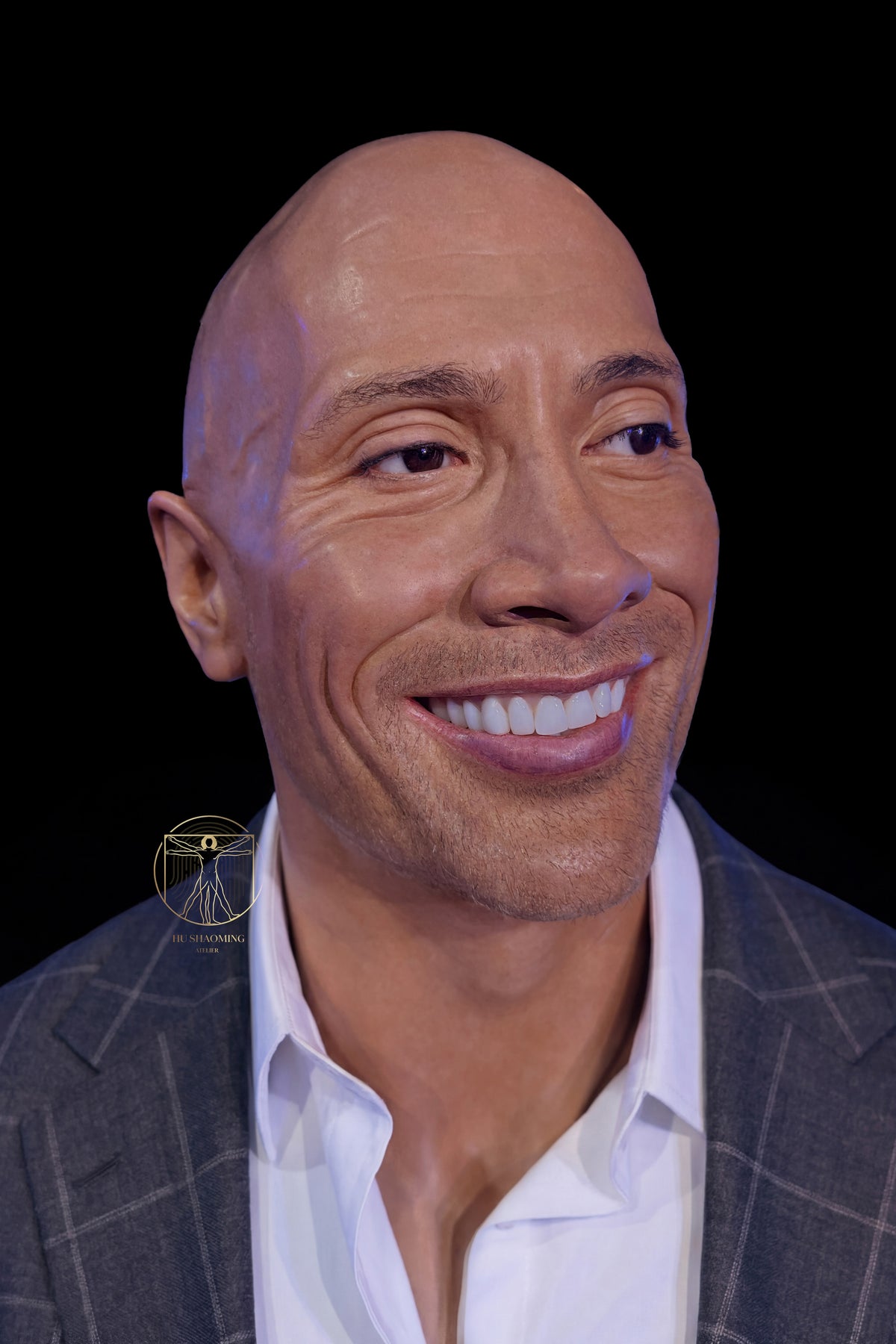 Detailed close-up of Dwayne Johnson silicone face showing realistic stubble and smile