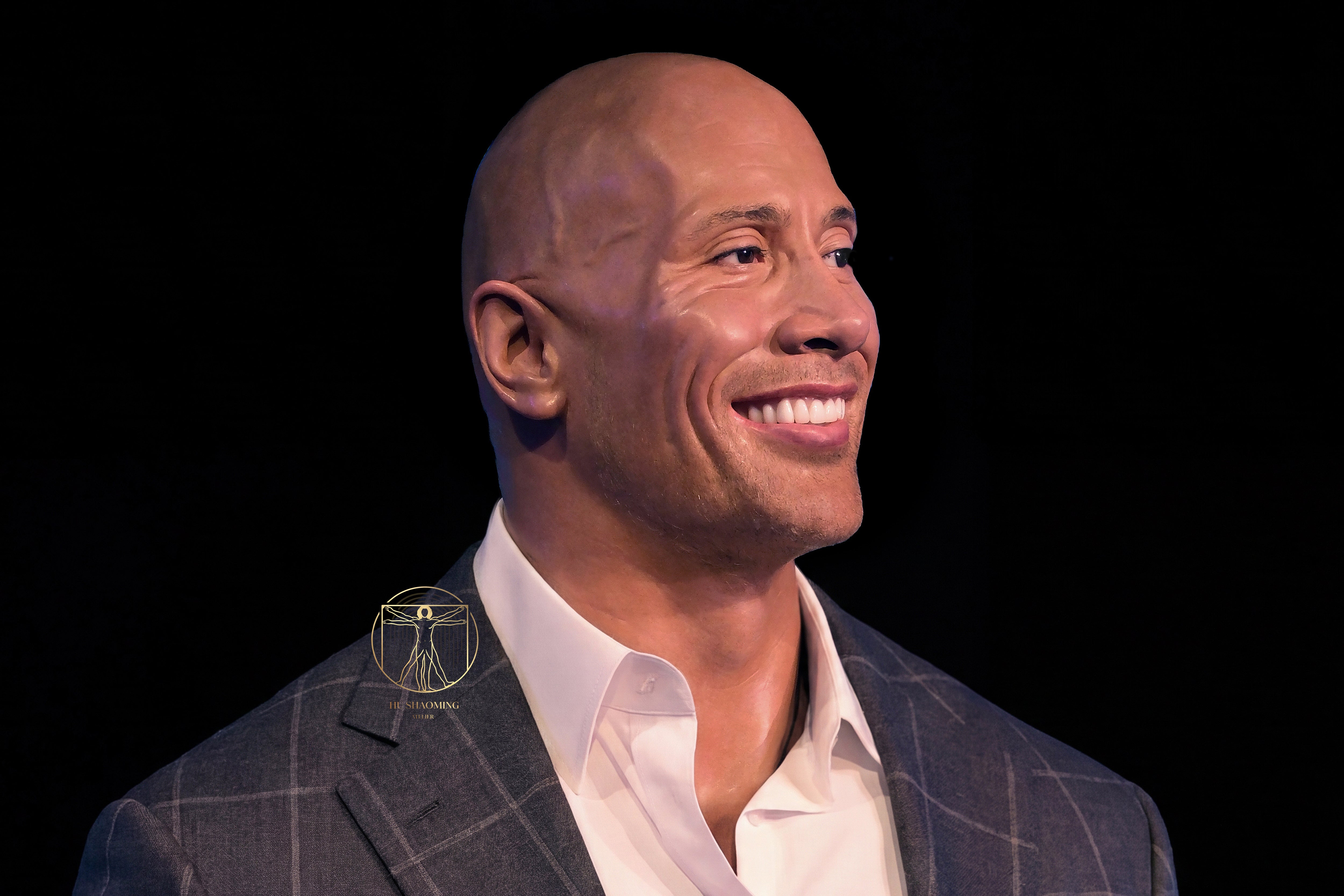 Hyperrealistic silicone sculpture of Dwayne "The Rock" Johnson smiling by Hu Shaoming