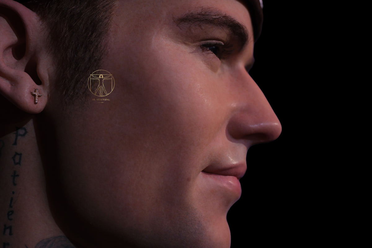 Hyperrealistic profile of Justin Bieber face sculpture with realistic glass eyes