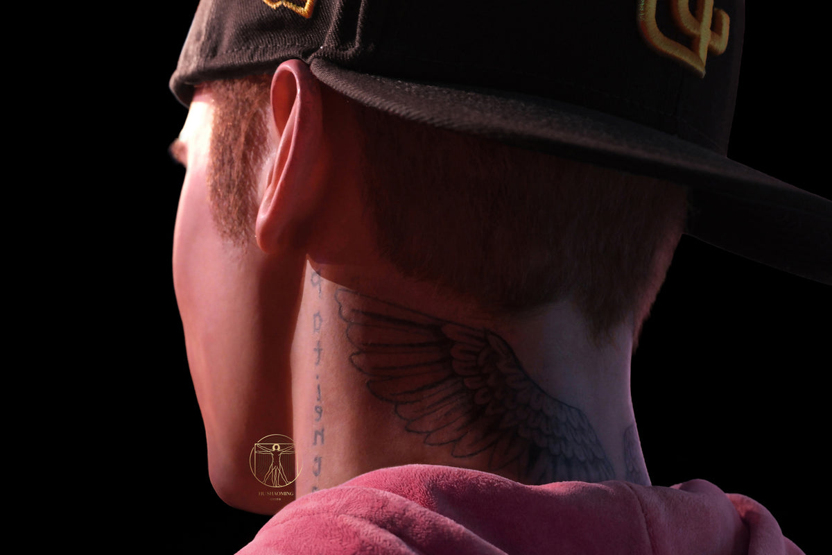 Close-up of the iconic wings neck tattoo on Justin Bieber silicone sculpture