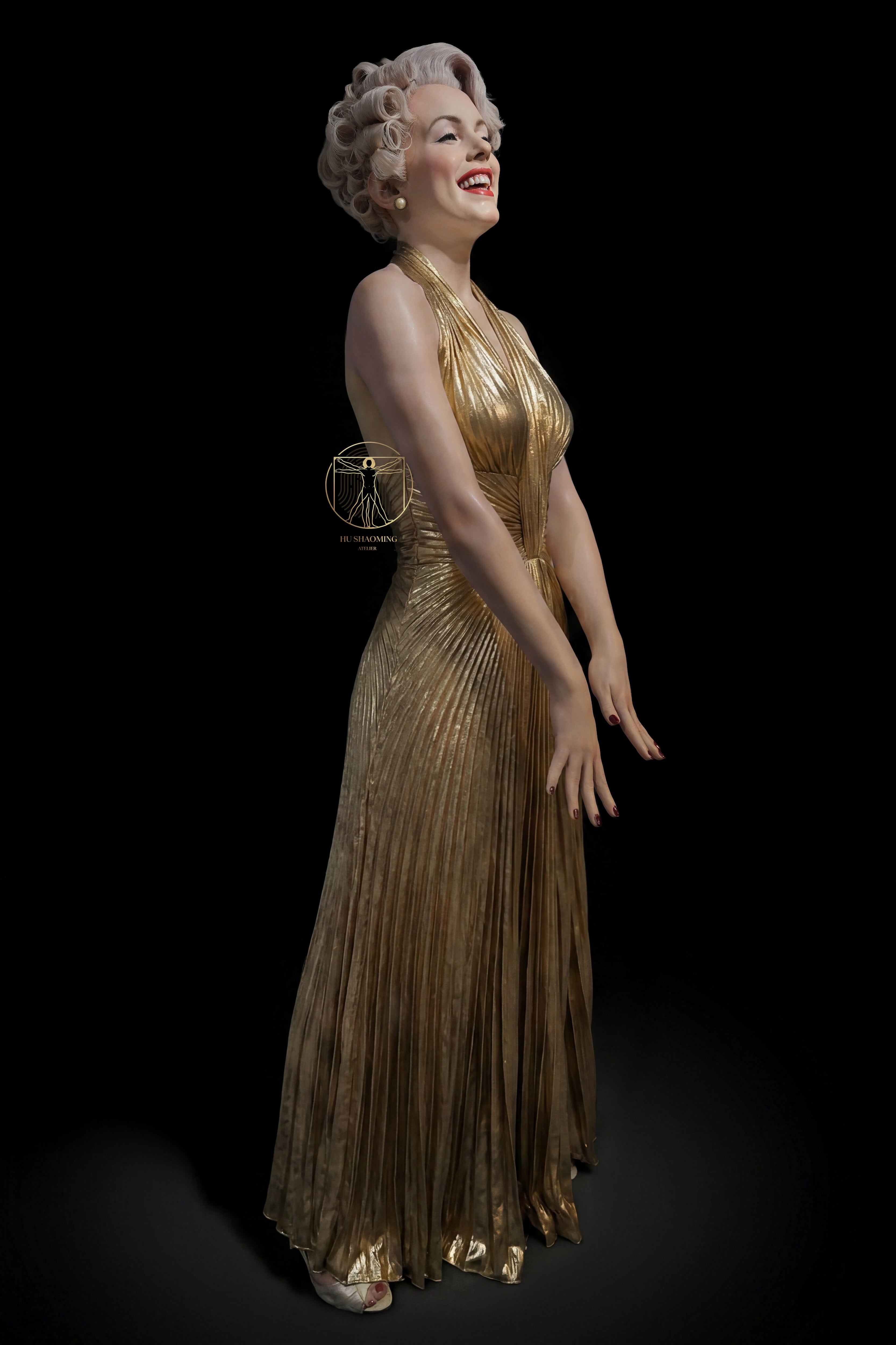Life-size Marilyn Monroe custom wax-style statue in the iconic pleated gold dress